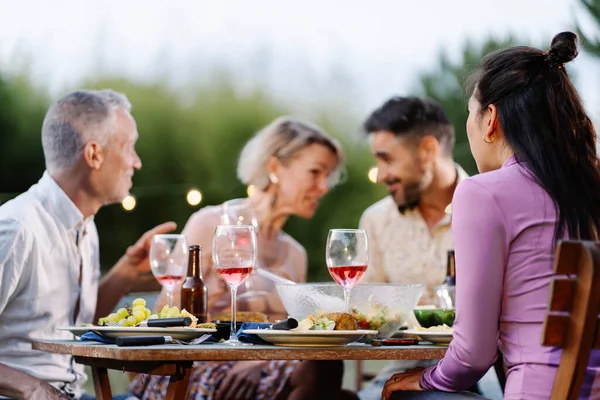 Friends Having Gossip Conversation Telling Whisper Secret Summer Dinner Outdoors — kuvapankkivalokuva