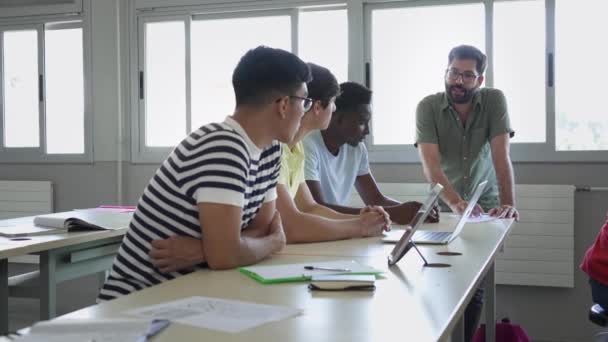 Young Professor Helping Multi Ethnic Male Students High School Classroom — Stock video