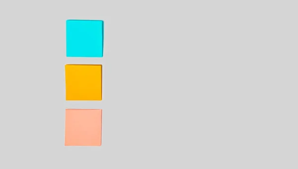 Three Blank Colorful Sticky Notes Gray Background Entering Text Top — Stockfoto