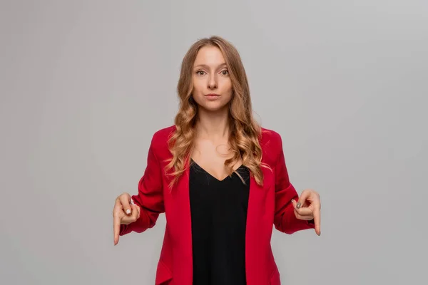 Skeptical Blonde Young Woman Pointing Fingers Looking Seriously Showing Something — Photo