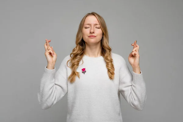 Dreamy Young Woman Makes Wish Crossed Fingers Close Eyes Pray — Stockfoto