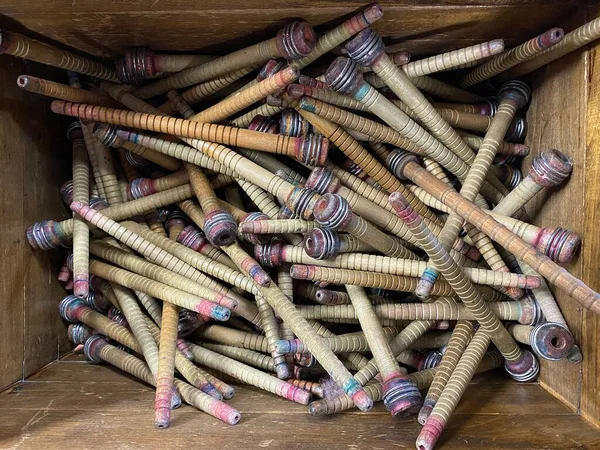 Wooden box with bobbin for yarn. Vintage reels for woolen mills. Bobbin for spindle bobbin machine.