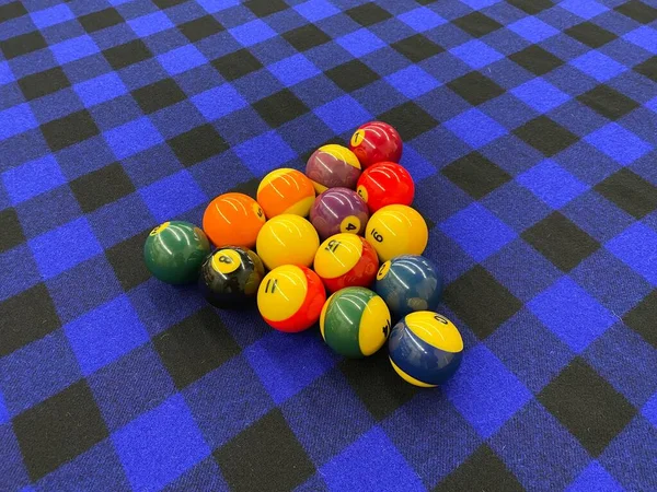 Billiard balls for American billiards. Pool balls. Billiard snooker pyramid. American pool. Pool game on table. Colored pool or billiard balls.