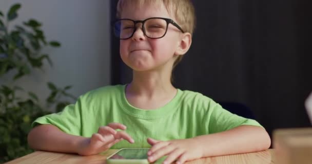 Happy Preschooler Boy Plays Games Phone Showing Thumbs Excited Blond — Vídeo de Stock