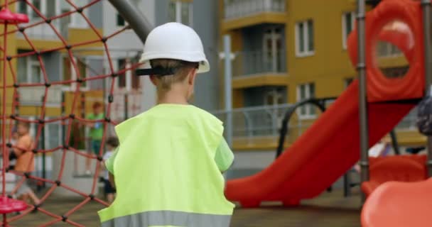 Happy Preschooler Boy Imagines Working Professional Builder Playground Excited Child — Vídeo de stock