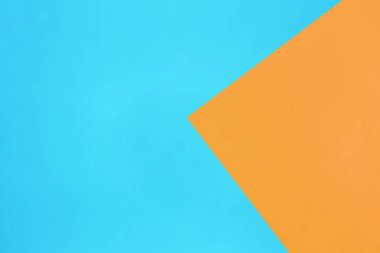 mavi ve turuncu pastel kağıt rengi üst görünüm minimal düz arkaplan