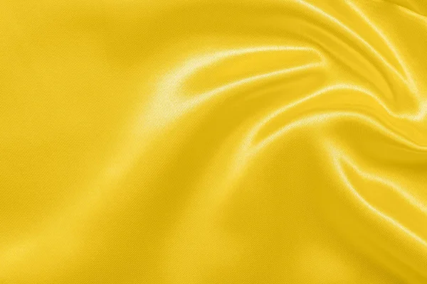 概要柔らかい波の質感の背景を持つ豪華な金の生地 — ストック写真