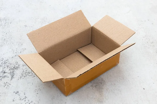 Open Empty Brown Cardboard Box Concrete Floor — Stock Photo, Image