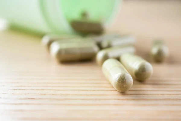 Herbal Medicine Capsules Bottle Wood Table — Stock Photo, Image