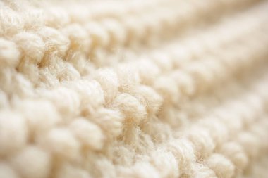 Kapat bej örgü yün kumaş dokusu arkaplanı