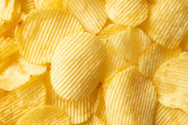 Çıtır çıtır patates cipsi, atıştırmalık dokusu arka planı.