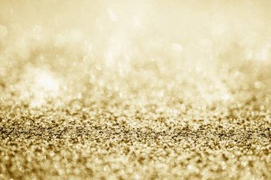 Soyut altın parıltısı arkaplan ile bulanıklaştırılmış