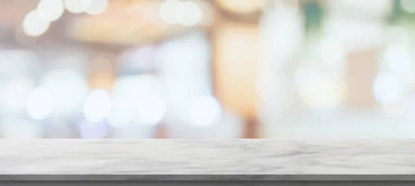 marble table top with blurred kitchen cafe restaurant interior background