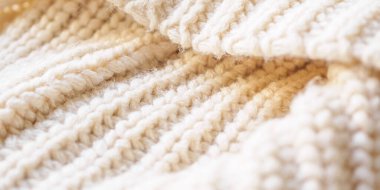 Kapat bej örgü yün kumaş dokusu arkaplanı