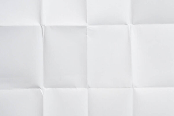 White folded and wrinkled paper texture background