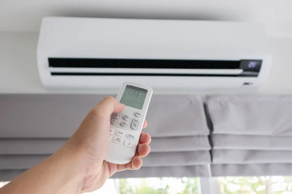 Hand Remote Control Directed Air Conditioner — Stock Photo, Image