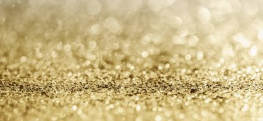 Soyut altın parıltısı arkaplan ile bulanıklaştırılmış