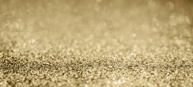 Soyut altın parıltısı arkaplan ile bulanıklaştırılmış