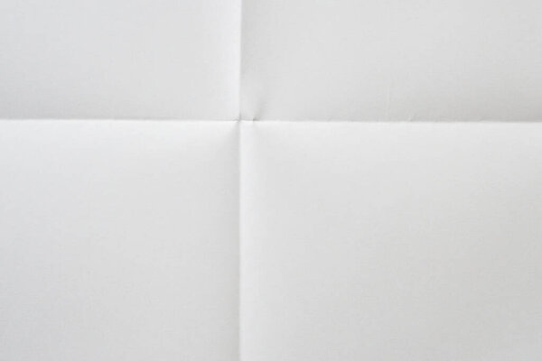White folded and wrinkled paper texture background