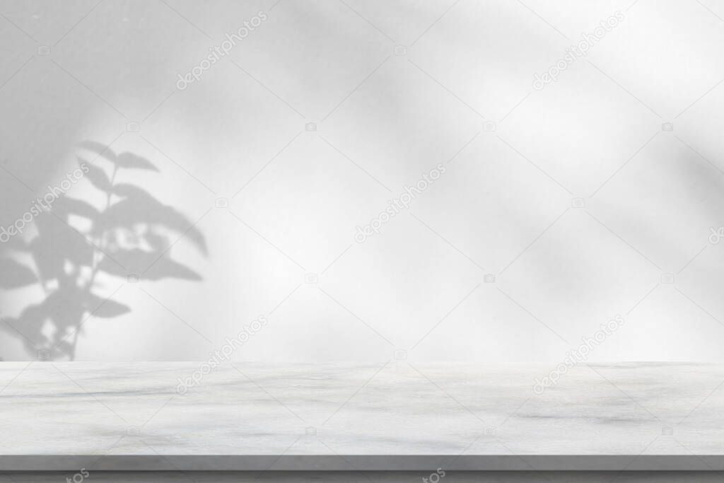 Marble table with tree shadow drop on white wall background for mockup product display