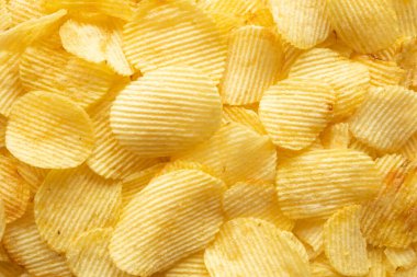 Çıtır çıtır patates cipsi, atıştırmalık dokusu arka planı.