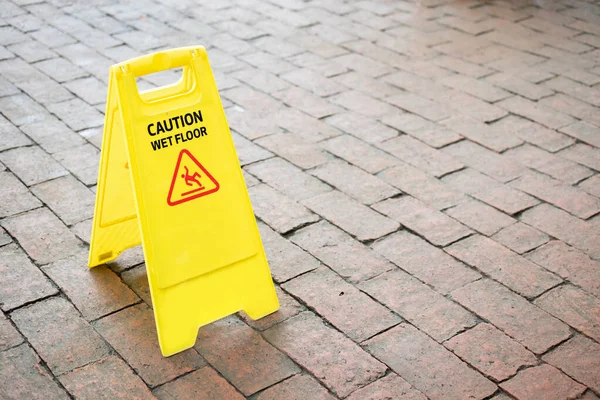 caution wet floor sign on the floor