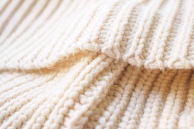 Kapat bej örgü yün kumaş dokusu arkaplanı