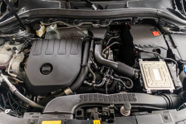 modern car engine under hood close up detail