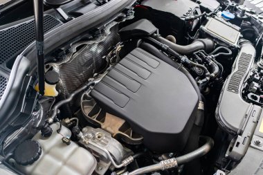 modern car engine under hood close up detail