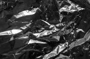 transparent plastic bag film wrap overlay texture on black background