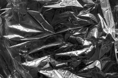 transparent plastic bag film wrap overlay texture on black background