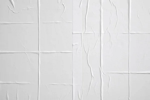 白色折皱和折皱的纸海报纹理背景 — 图库照片