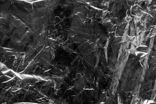 прозрачная пластиковая пленка накладывается текстура на черный фон