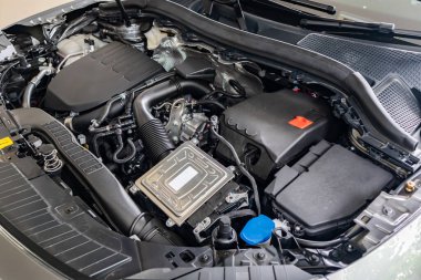 modern car engine under hood close up detail