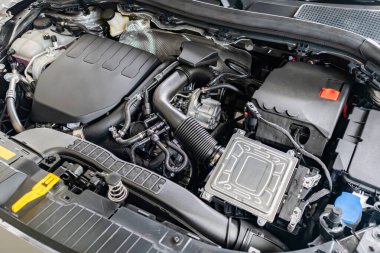 modern car engine under hood close up detail