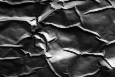 Siyah buruşmuş ve buruşmuş plastik poster dokusu arka planı