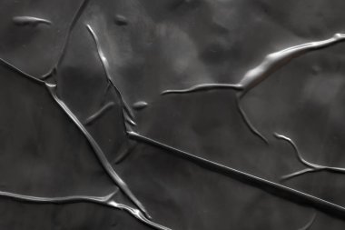 Siyah buruşmuş ve buruşmuş plastik poster dokusu arka planı