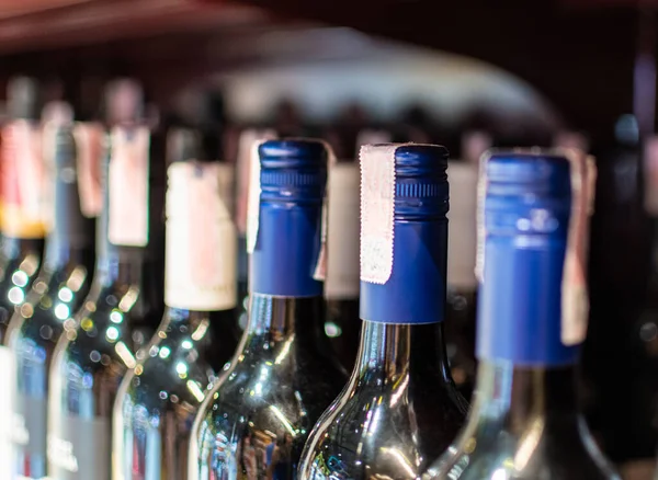 Bottles of wine are placed on a shelf in a department store. Drink concept for parties, weddings, birthdays, Valentine's Day. selective focus, Close up, copy space