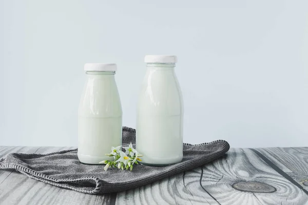 Beverage Liquid Milk White Fresh Natural Two Glass Bottles Table — Stock fotografie