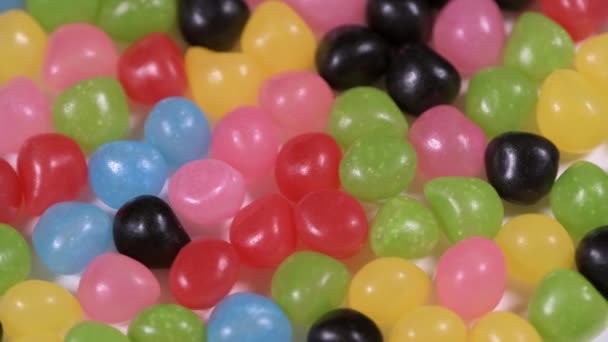 多色のお菓子とガムの回転背景 — ストック動画