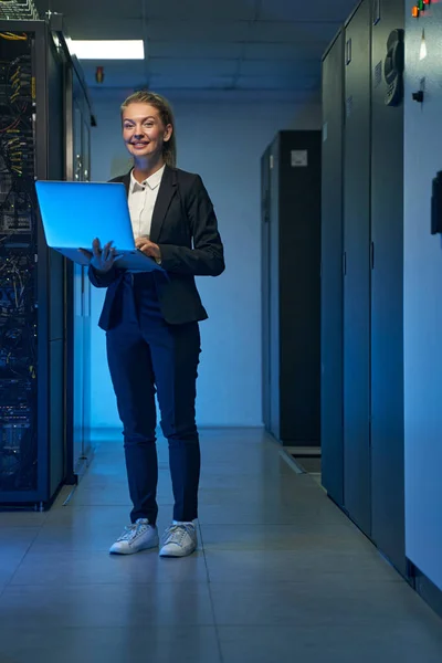 Smiling system administrator working on cyber security in data center — Stok Foto