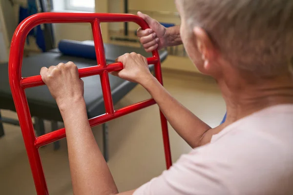 Shot of mature woman with walking disability in rehab center — Stock Photo, Image