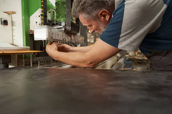 Close up of senior master working in joinery — Foto Stock