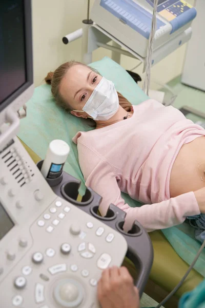 Close up of young woman doing ultrasonography — Stock Photo, Image