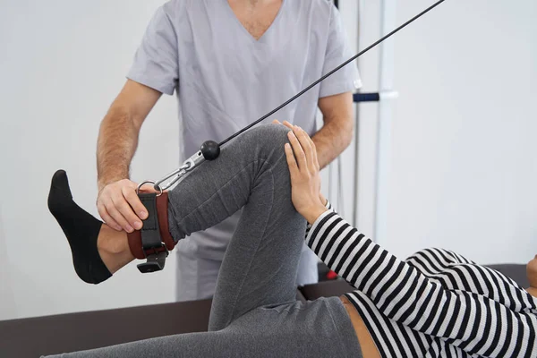 Young female having rehabilitation in the gym — Stock Photo, Image