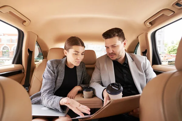 Businessman Holding Cup Coffee Pointing Documents While Working Female Colleague — Stock Photo, Image