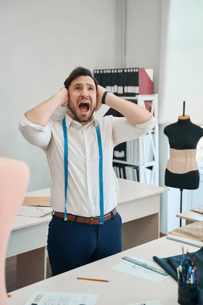 Anxious Fashion Designer Stands Middle Room His Mouth Wide Open — Foto Stock