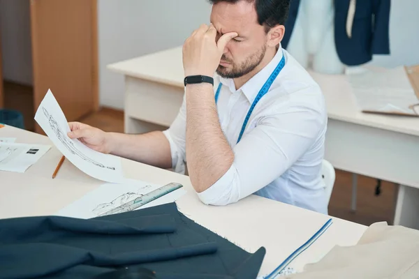 Exhausted Fashion Designer Sits Desk Eyes Closed Left Hand While — Foto Stock