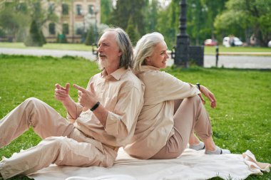 Kind male person actively gesticulating while communicating with his partner