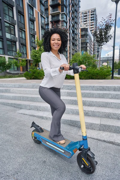 Smiling Multiracial Young Woman Standing Yellow Blue Scooter — 图库照片